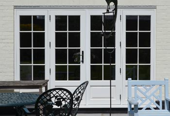 French Doors with period panels and Georgian Slim glazing bars further enhance the traditional feel