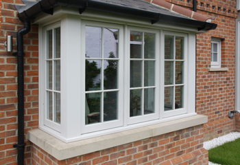 Edwardian square bay window with deep mouldings
