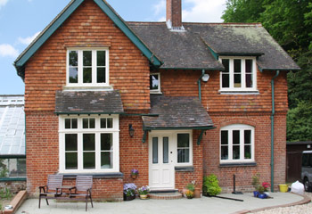 Replacement timber Flush Casement windows in Cottage Style for this rustic cottage in Dorking, Surrey