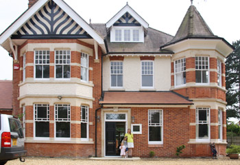 Our Elegant timber Slimline Sash Windows with unique glazing bar detail for this magnificent Victorian home in Oxshott, Surrey