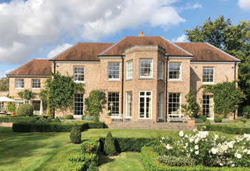Slimline timber sash windows and French doors for the impressive Newbuild country house in Virginia Water, Surrey 