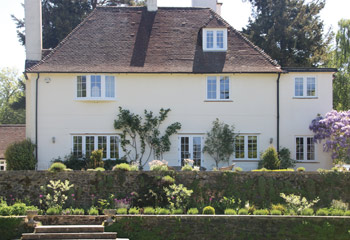 Replacement timber flush casement windows for this 1920’s graceful Country house in Esher, Surrey