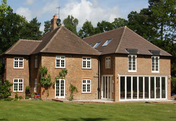 New and replacement Flush timber casement windows and bifold doors for this elegant country house in Reigate, Surrey