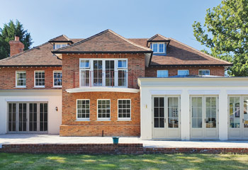 Slimline Flush Casement windows with elegant French doors for this newbuild Arts & Crafts House in Godalming, Surrey 