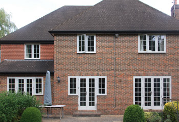 Replacement timber flush casement windows in Light Grey for this cottage in Kew