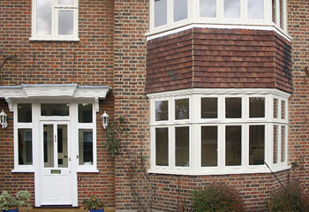 Replacement timber casement windows for this cottage in Thames Ditton